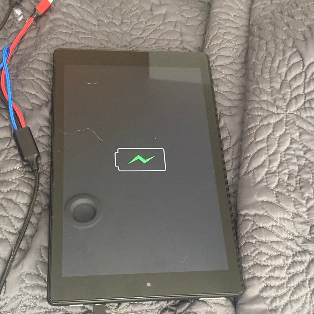 Sleek Black Tablet with Charging Cable